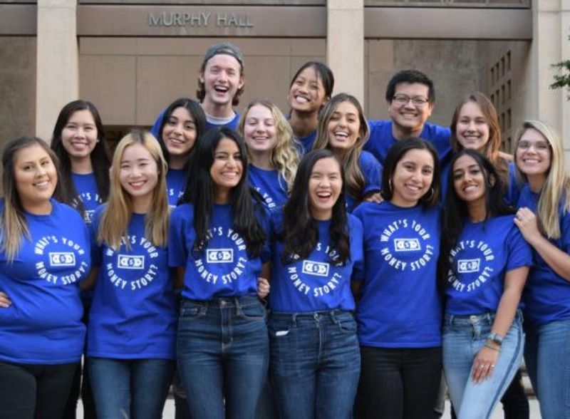 A large group of people posing for a photo in front of Murphy Hall